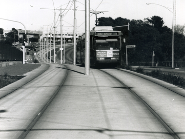 A tram the Burwood Highway, coming east from the Middleborough intersection and shopping centre. 1994 