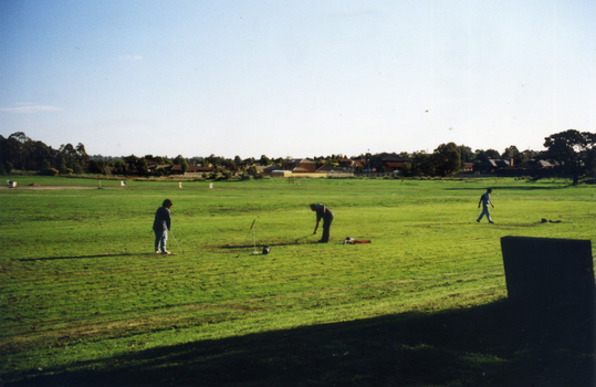 Early days in the development of the Morack Golf Course. Overview of a hole plus white patches indicating where trees have been planted.