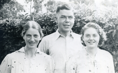 Evelyn Till and her children, Alwyn and Alison.Outdoors, hedge behind