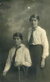 Studio photograph of Evelyn Maggs, seated, with her sister Harriet