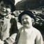 Alwyn and Alison Till, wearing hats. Background sea shore at Phillip Island. 