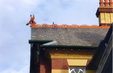 Section of the roof at Bundoora Park, Bundoora, showing ornamental detailing and a griffin, which was supplied by the Australian Tesselated Tile Co. of Mitcham