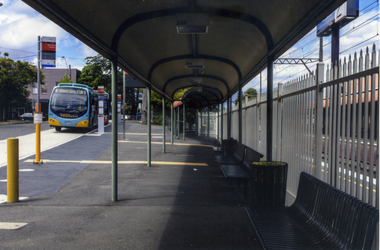  Venture bus pulling into the bus stop on the south side of Mitcham Railway Station.Behind the bus is a building which is the start of a large industrial estate that runs alongside the railway line to Rooks Road, Nunawading - 2012