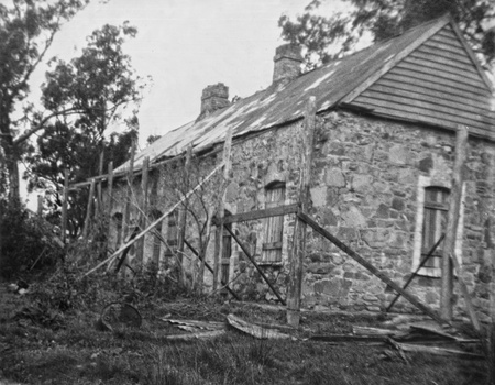 Schwerkolt cottage which has been boarded up to stop vandalism.