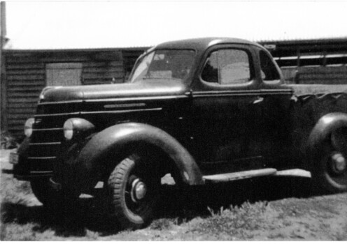 Black and white photograph of a dark coloured ute used at Davins Dairy, Corner Mitcham Road and Victoria Avenue Mitcham.