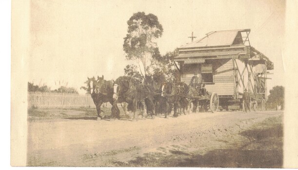 Sepia photo of house moving.