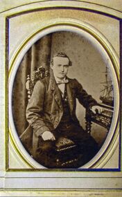 sepia photograph with a framed picture of a man