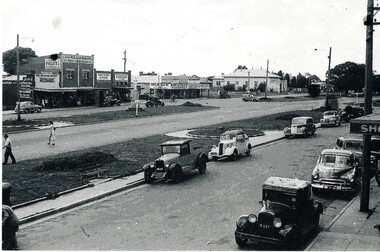 An early black and white photograph of the Mitcham shopping centre. 