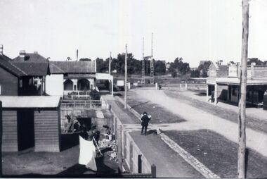An early black and white photograph of Station Street Mitcham. 