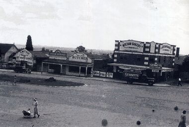 Black and white photograph of the early shops on the Northern side of Whitehorse Road Mitcham.
