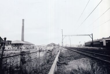 Early photograph of a railway line heading West towards the city.