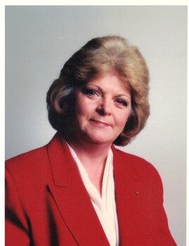 Coloured photograph of Kaele Way wearing a red jacket