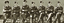 Black and white photograph of 7 airmen seated in uniform.
