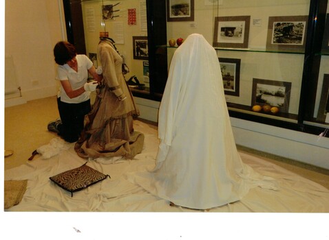 Costumes being prepared for display in museum.