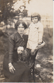 Francis Hogan (nee Schwerkolt) with her son Leslie standing on a chair and a small dog on her lap