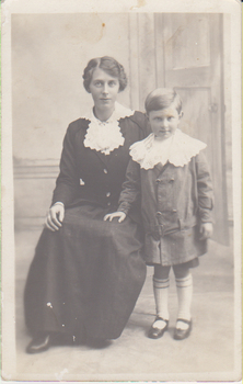 Black & white studio portrait of Frances Hogan and her son, Leslie. 