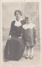 Black & white studio portrait of Frances Hogan and her son, Leslie. 