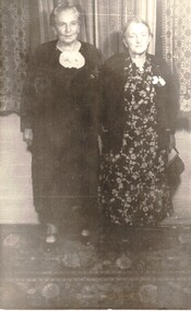 Darkish black & white photograph of Francisca (Cissie) Schwerkolt on the right and Dora Van Prooyen. 