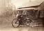 Billy on motorbike outside grandmas place. 