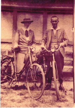 Arthur and Janet Hooke with their bicycles. Black and white photograph.