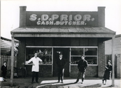  Dud Prior outside his second butcher shop in Blackburn Road , built in 1920.