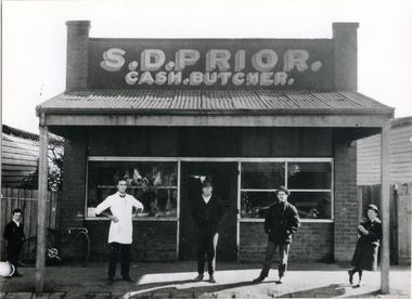  Dud Prior outside his second butcher shop in Blackburn Road , built in 1920.