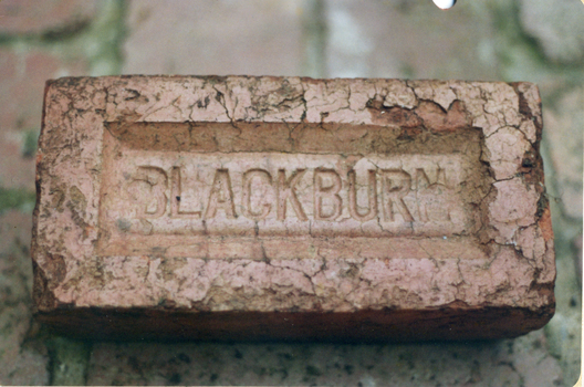 Red brick stamped 'Blackburn'.
