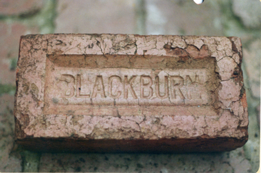 Red brick stamped 'Blackburn'. One of the major industries in Blackburn.