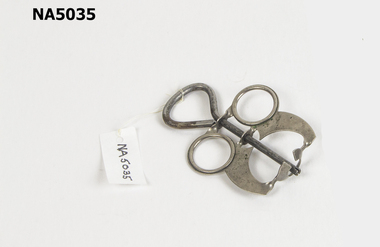 Small metal utensil to remove cherry pips.