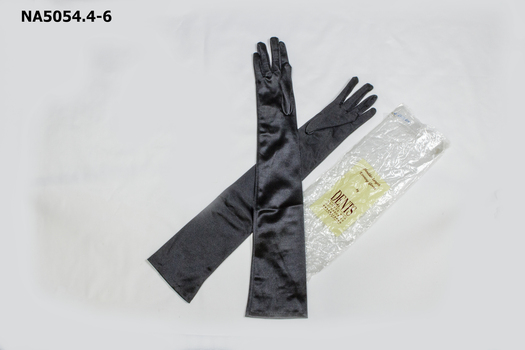 Shoulder length black stretch satin gloves in original packet.