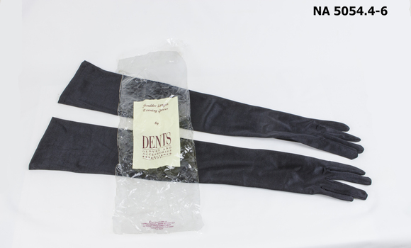 Shoulder length black stretch satin gloves with original packet.