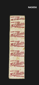 A roll of fabric shirt labels