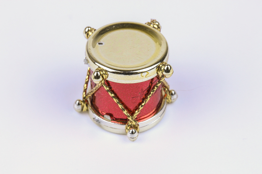 Miniature red and gold drum