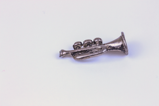 miniature silver-coloured trumpet