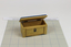 natural-coloured wooden toy chest with blue, velvet padded lid