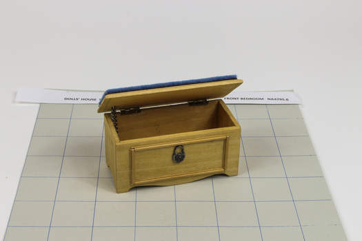 wooden toy chest with blue, velvet padded lid