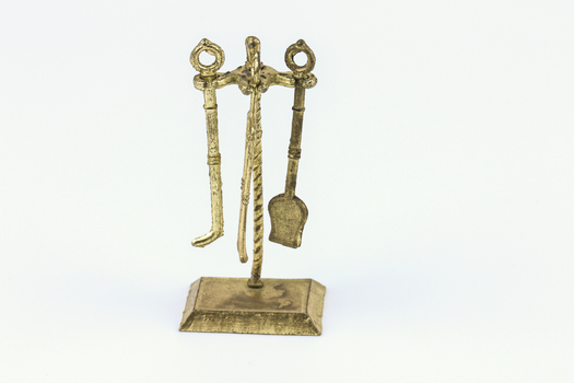 Brass fire irons.
