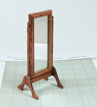 Long mirror on tilt frame