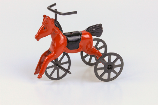 Red and black painted rocking horse tricycle