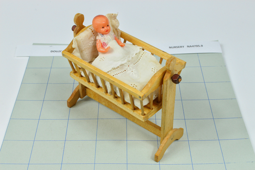 Natural wood cradle on stand