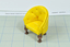 Yellow vinyl upholstered tub-style chair