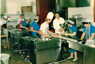 Meals on Wheels preparation of food for delivery.