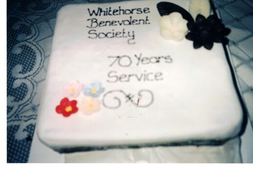 Coloured photograph of a cake celebrating  70 years of  the Whitehorse Benevolent Society.