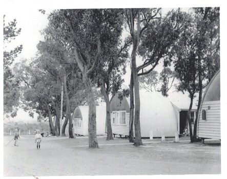 Black & White photo of people at hostel.  3