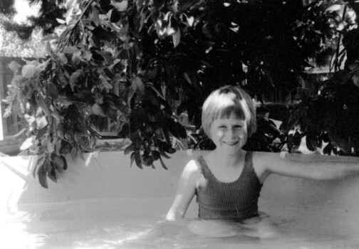 Julie Suto in backyard swimming pool.