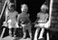 Julie Suto and friends sitting on step. 