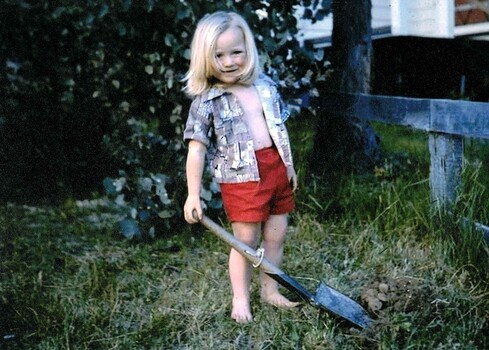 Kelly Gardiner in backyard with spade