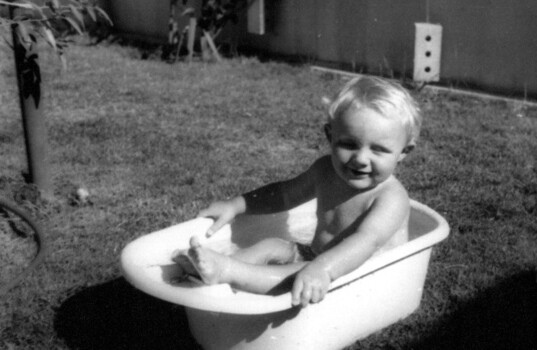 Nick Rogalski in bath in backyard