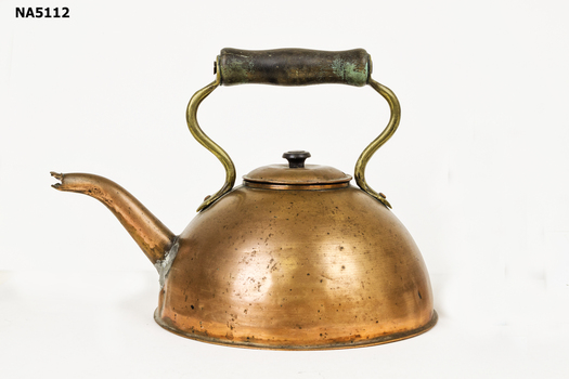 Copper kettle with wooden handle and spout.