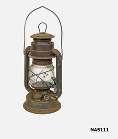 Metal kerosene hurricane lamp.